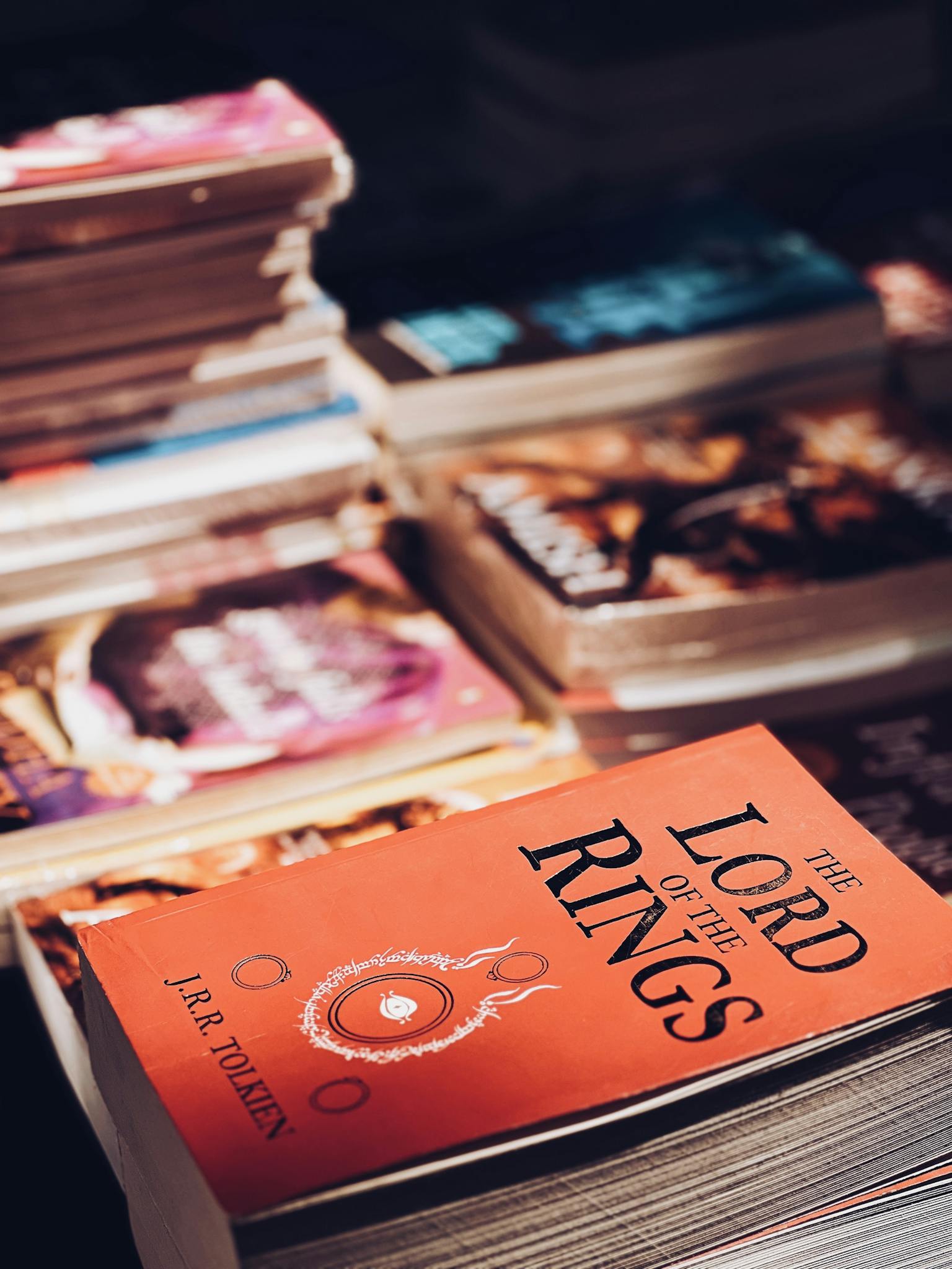 Close-up of a stack of books with The Lord of the Rings prominently displayed in a bookstore.